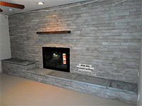 Manufactured stone fireplace installation